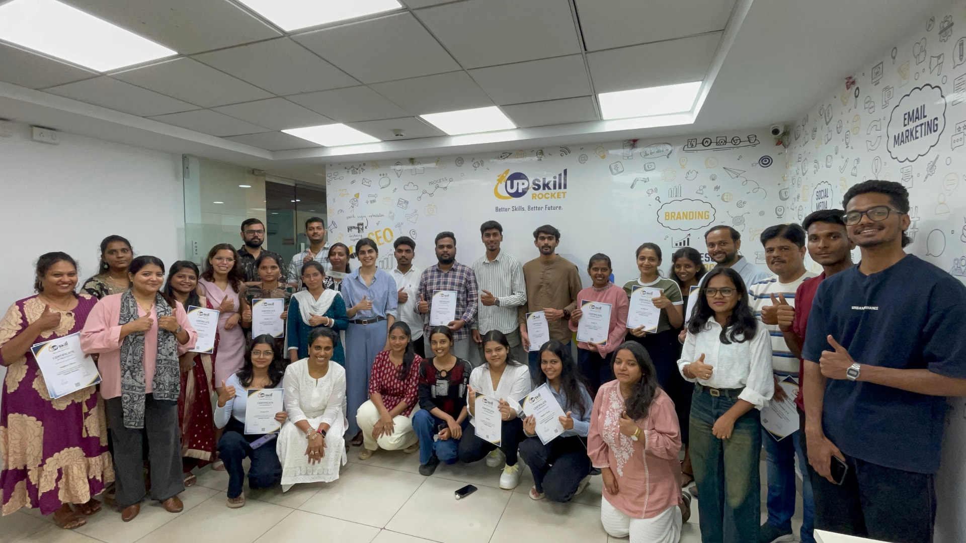 Upskill Rocket batch holding their course completion certificates