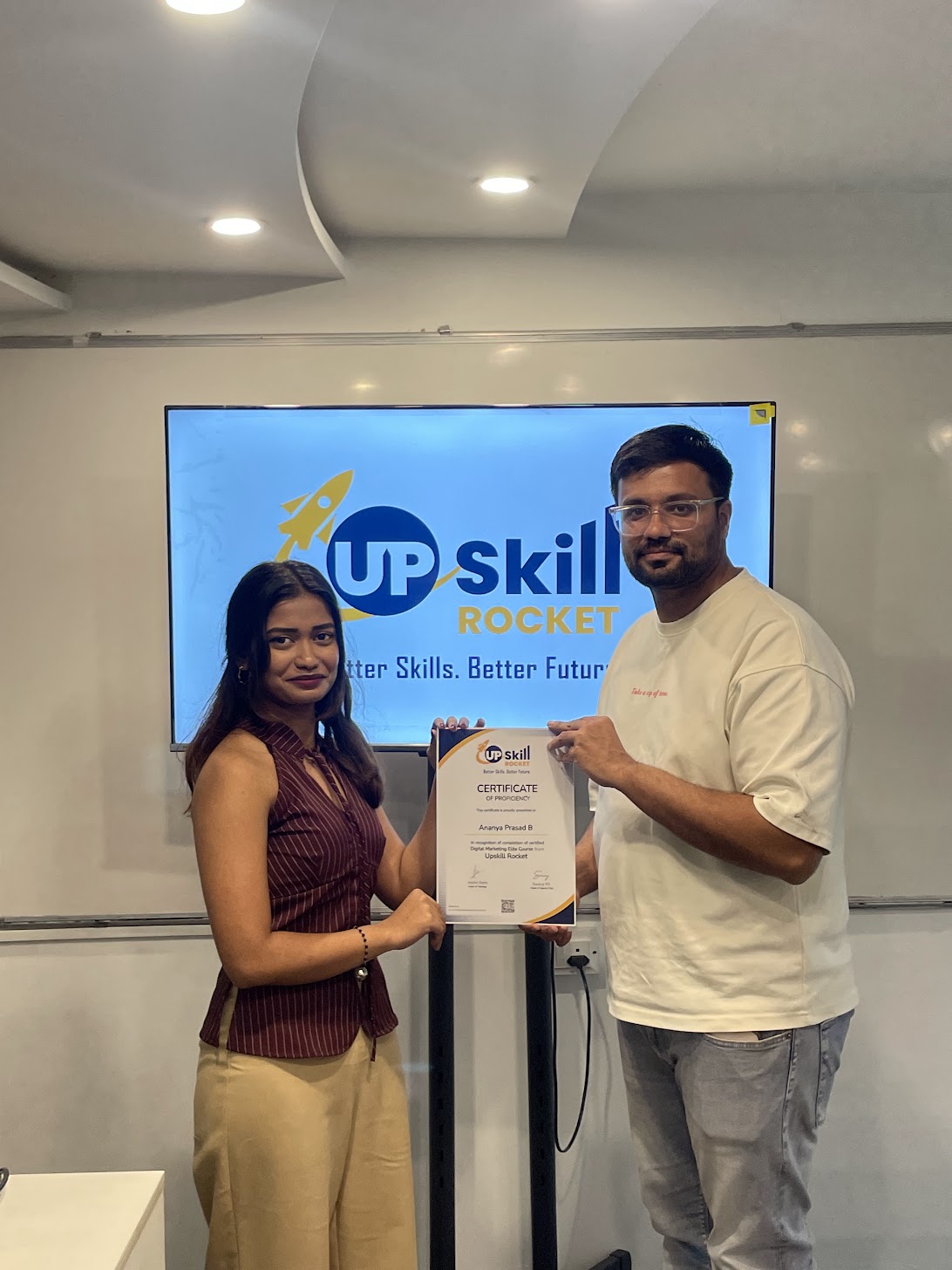 Learner receiving her Upskill Rocket elite course certificate